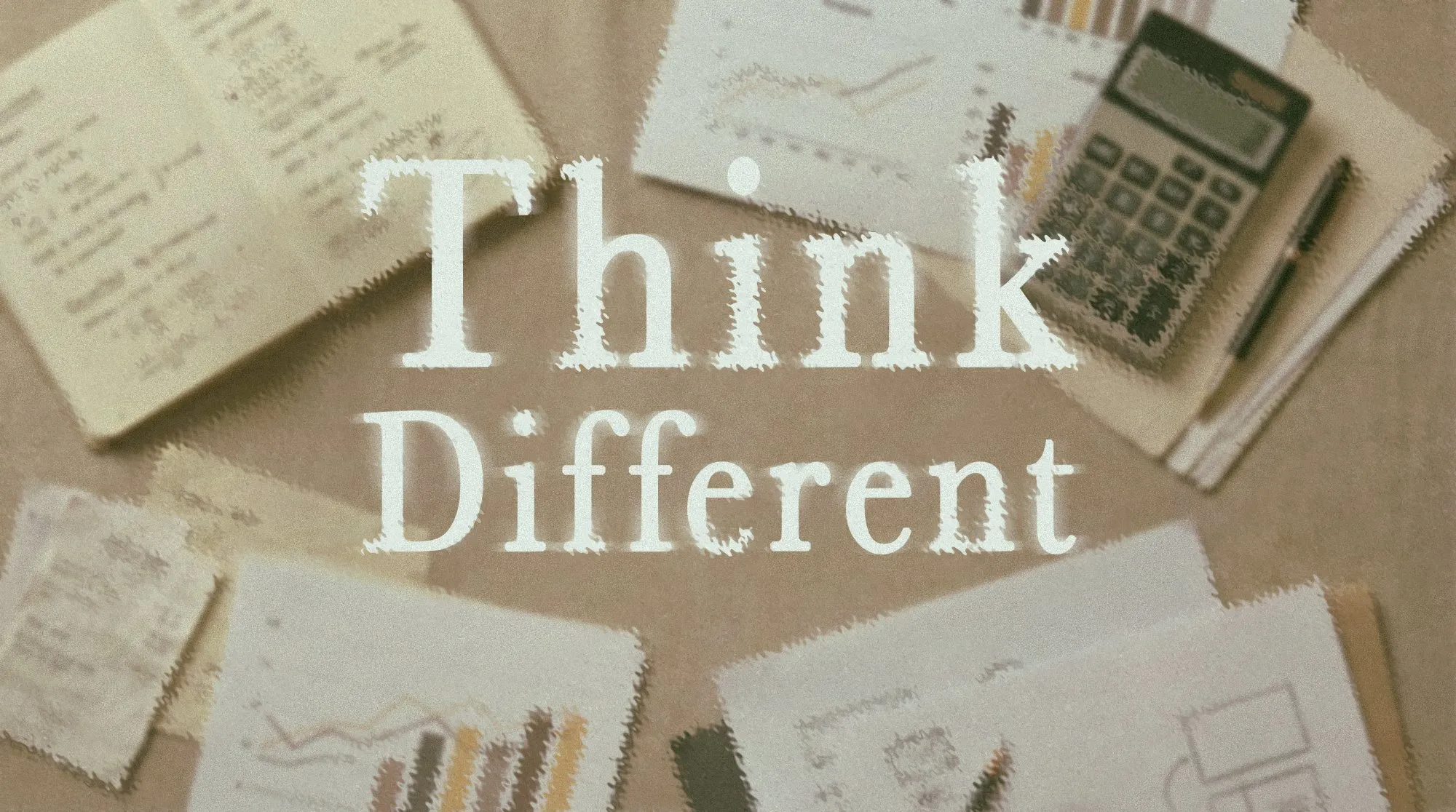 Strategy desk with financial notes, calculator, and Think Different typography overlay, design leadership and business thinking